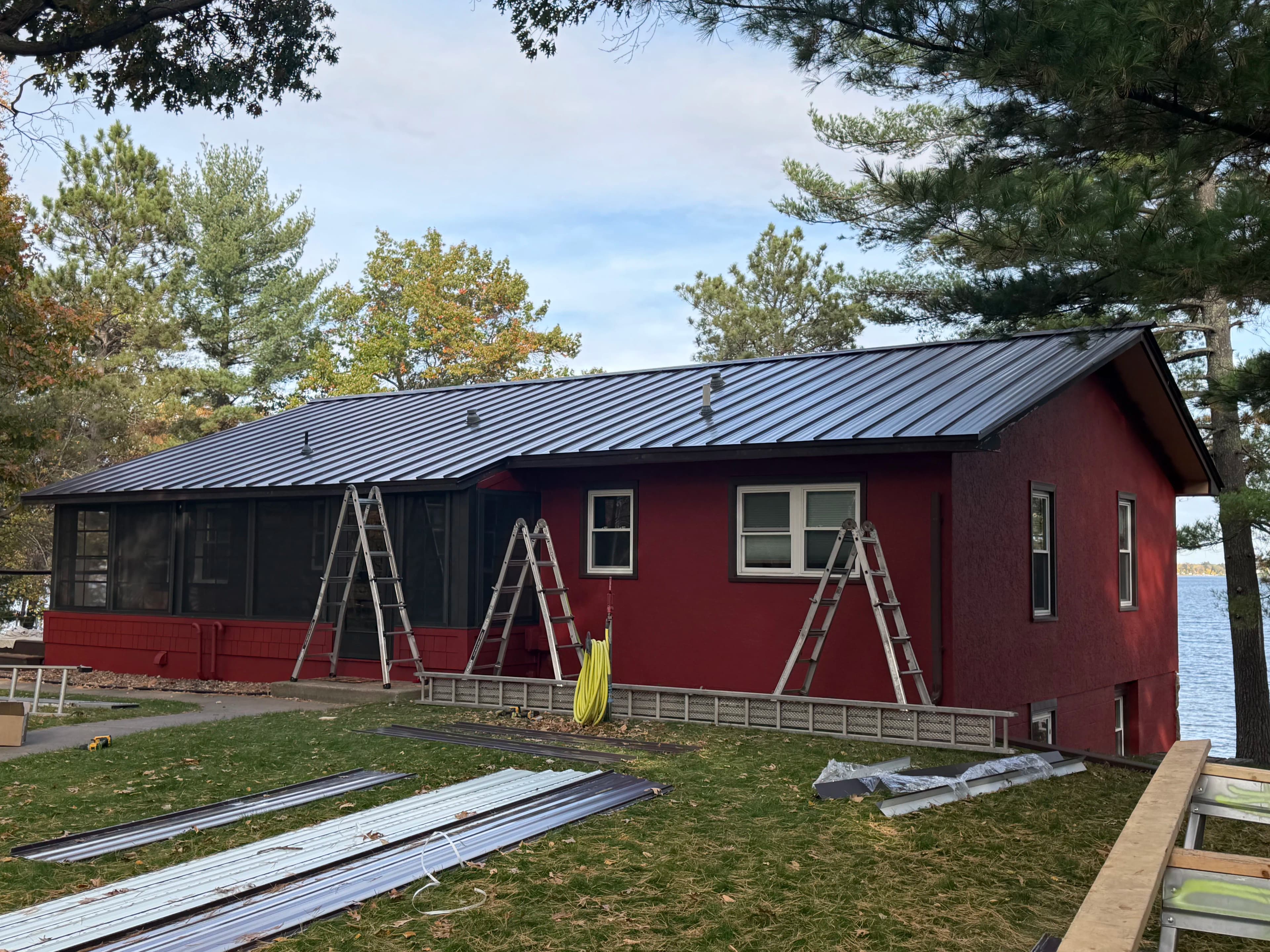 Project Standing Seam Metal Roof Nearly Complete on This Lakeside Home image
