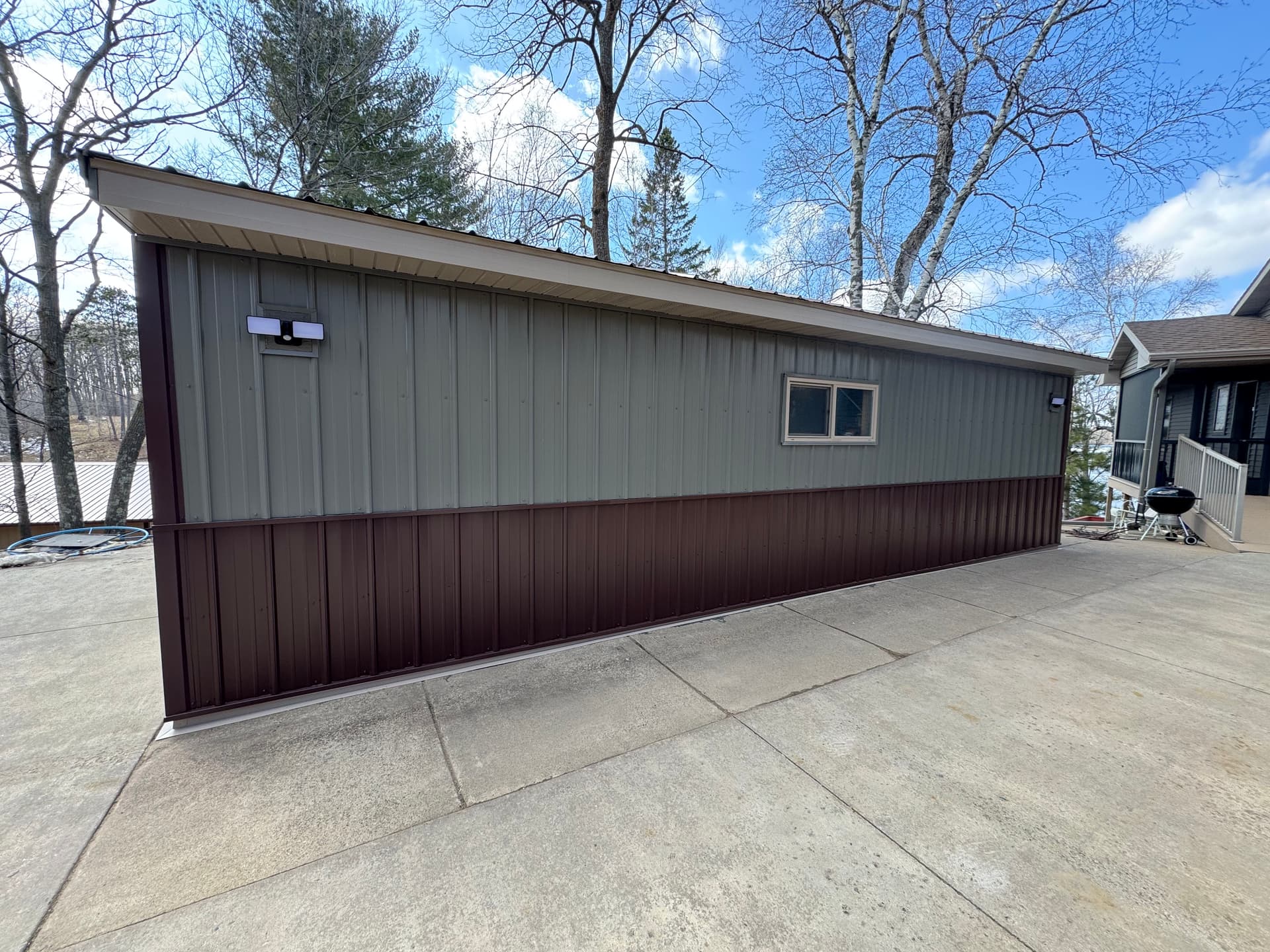 Gallery photos for Old Wood Paneling Out, New Steel Siding In on This Garage: Image #1