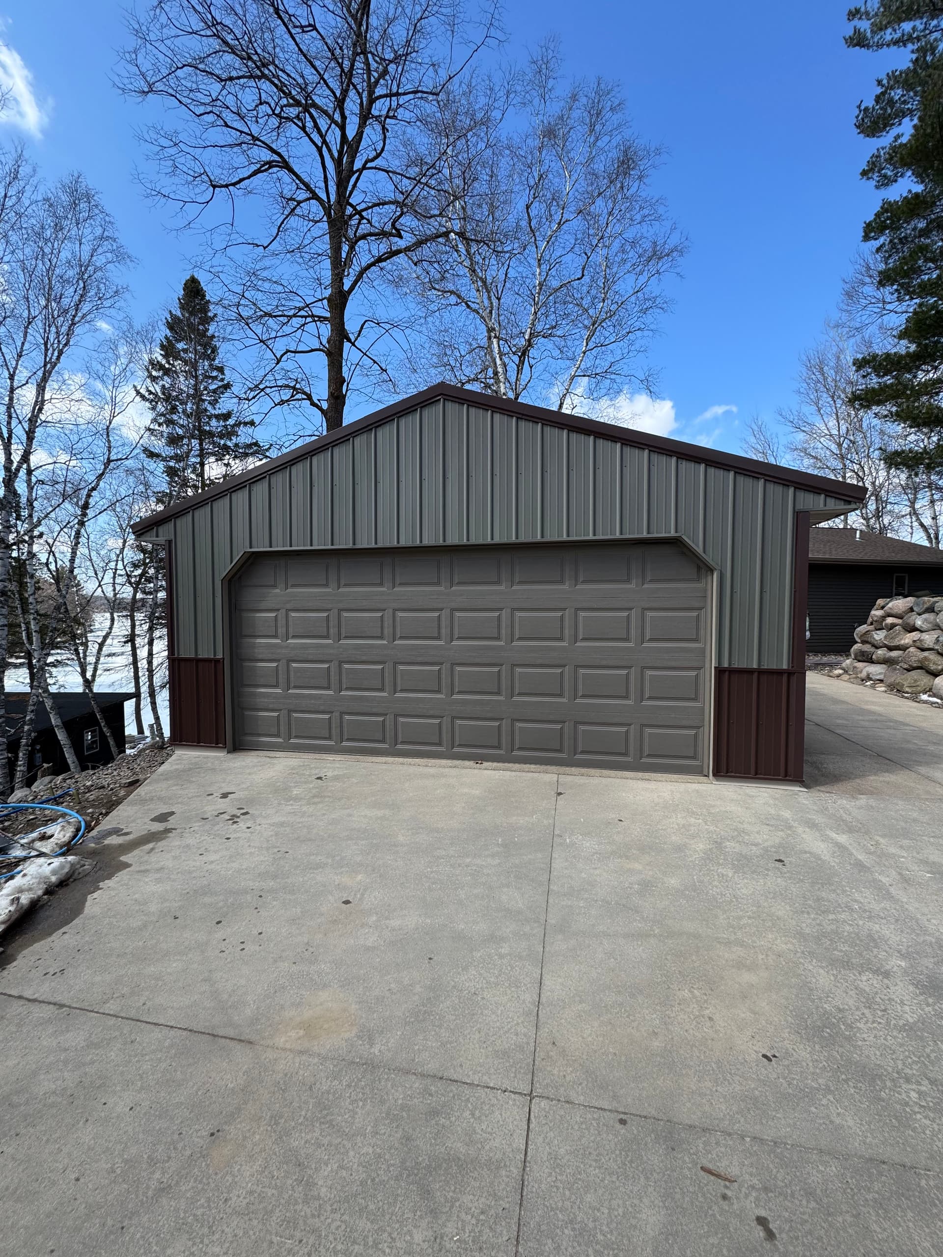 Old Wood Paneling Out, New Steel Siding In on This Garage image